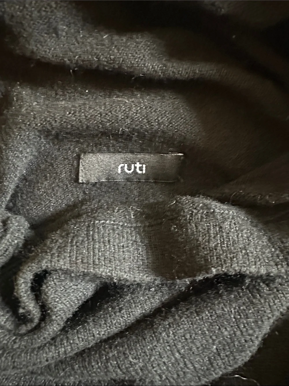 Black Ruti M/L cowl neck high low sweater with pockets.